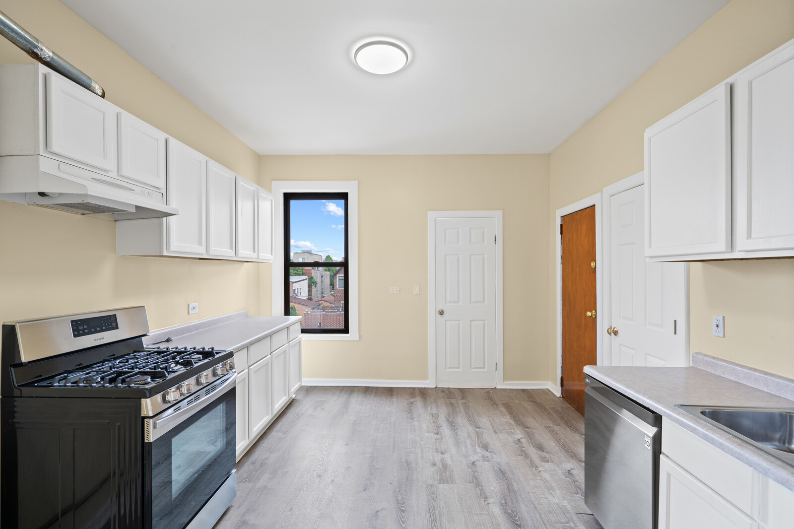 1331 West Huron Street Chicago, IL 60642 - Photo 5 of 11 a kitchen with a stove and a refrigerator