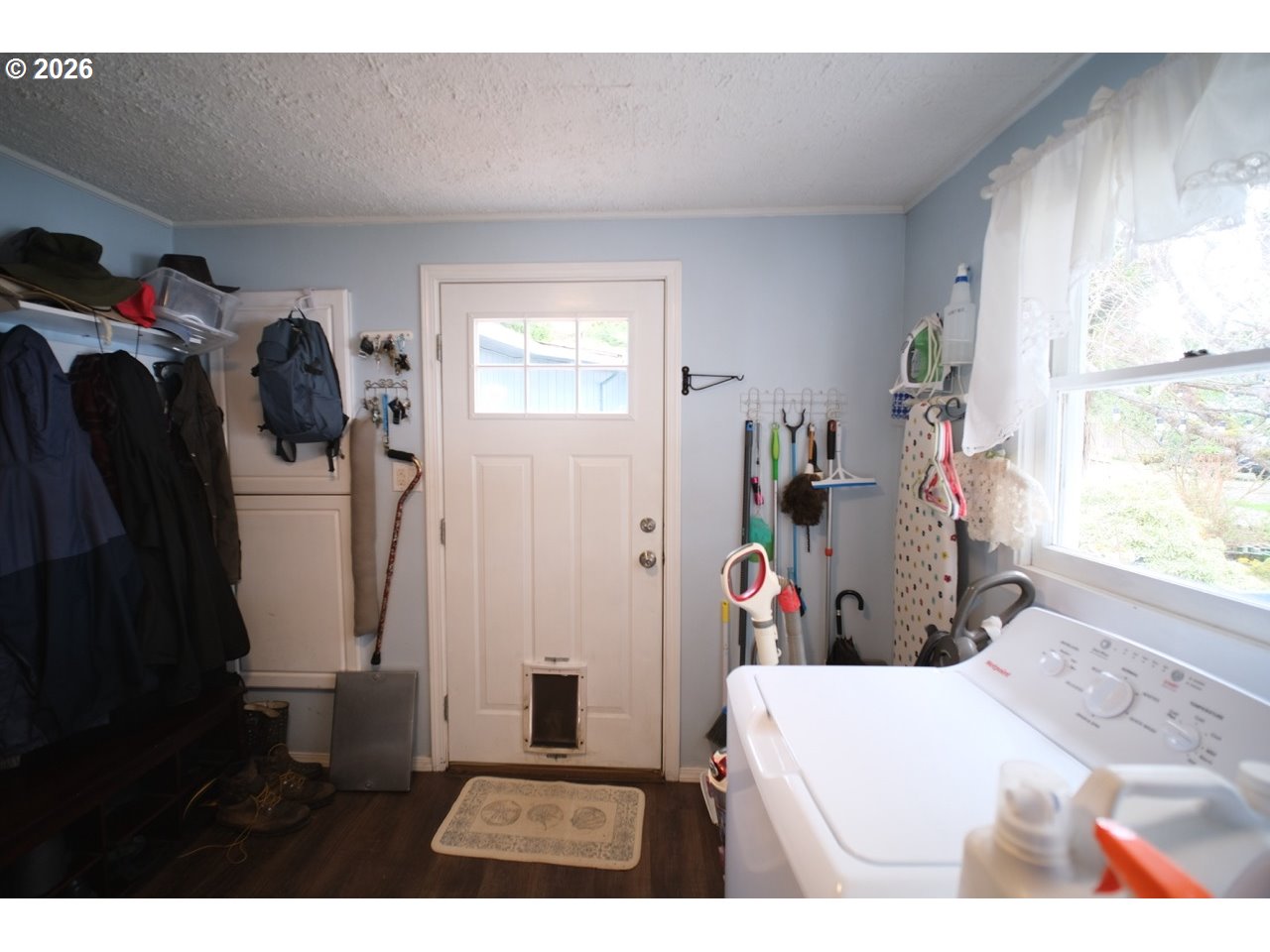 70214 Lakewood Road North Bend, OR 97459 - Photo 17 of 39 a bed room with a bed and a window