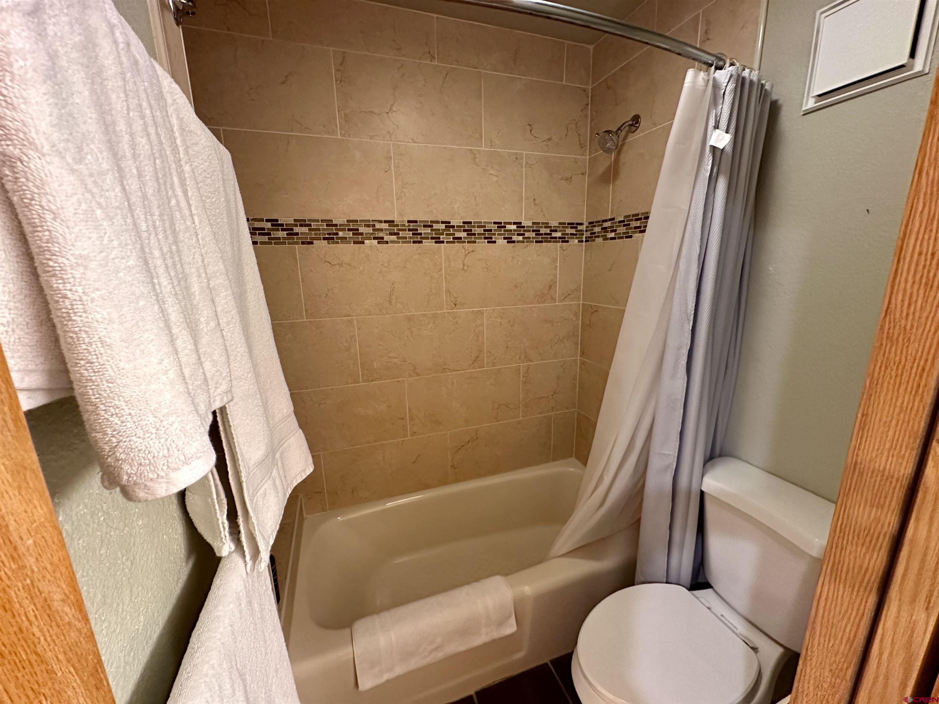 71 Needles Way, Unit 340 Durango, CO 81301 - Photo 20 of 40 a bathroom with a shower and a toilet