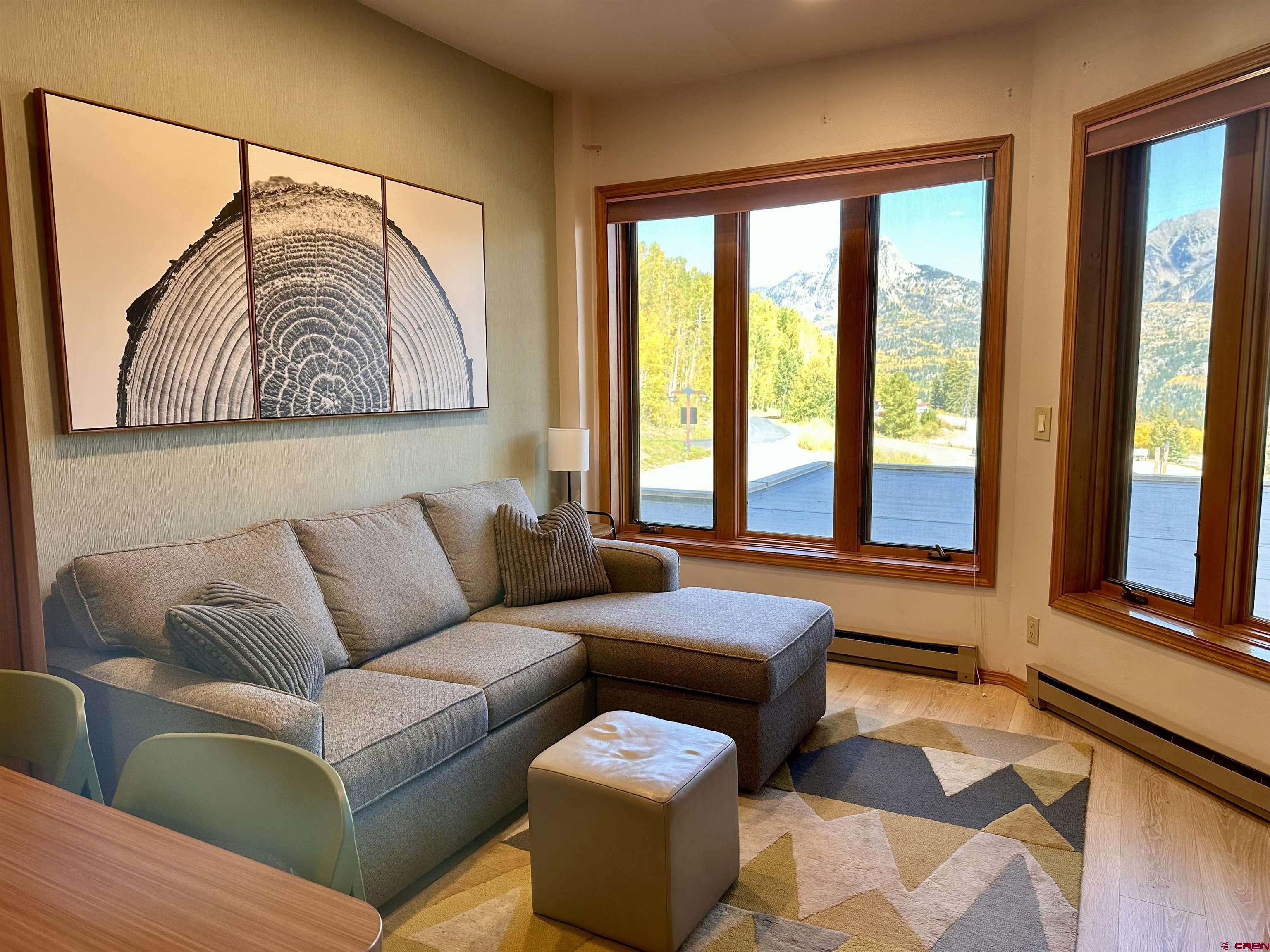 71 Needles Way, Unit 340 Durango, CO 81301 - Photo 10 of 40 a living room with furniture and a floor to ceiling window