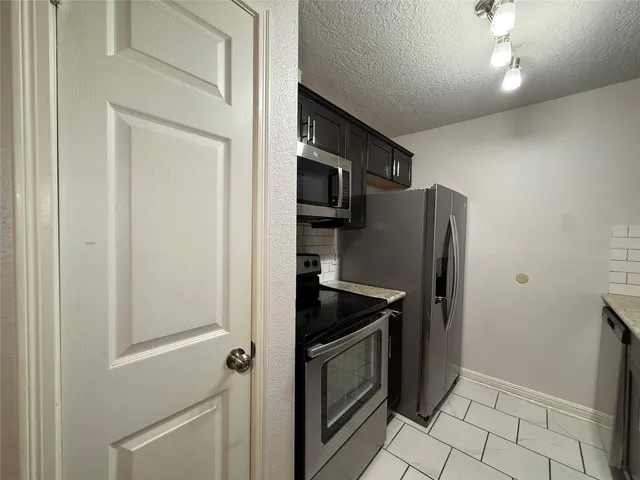 a white toilet sitting next to a shower