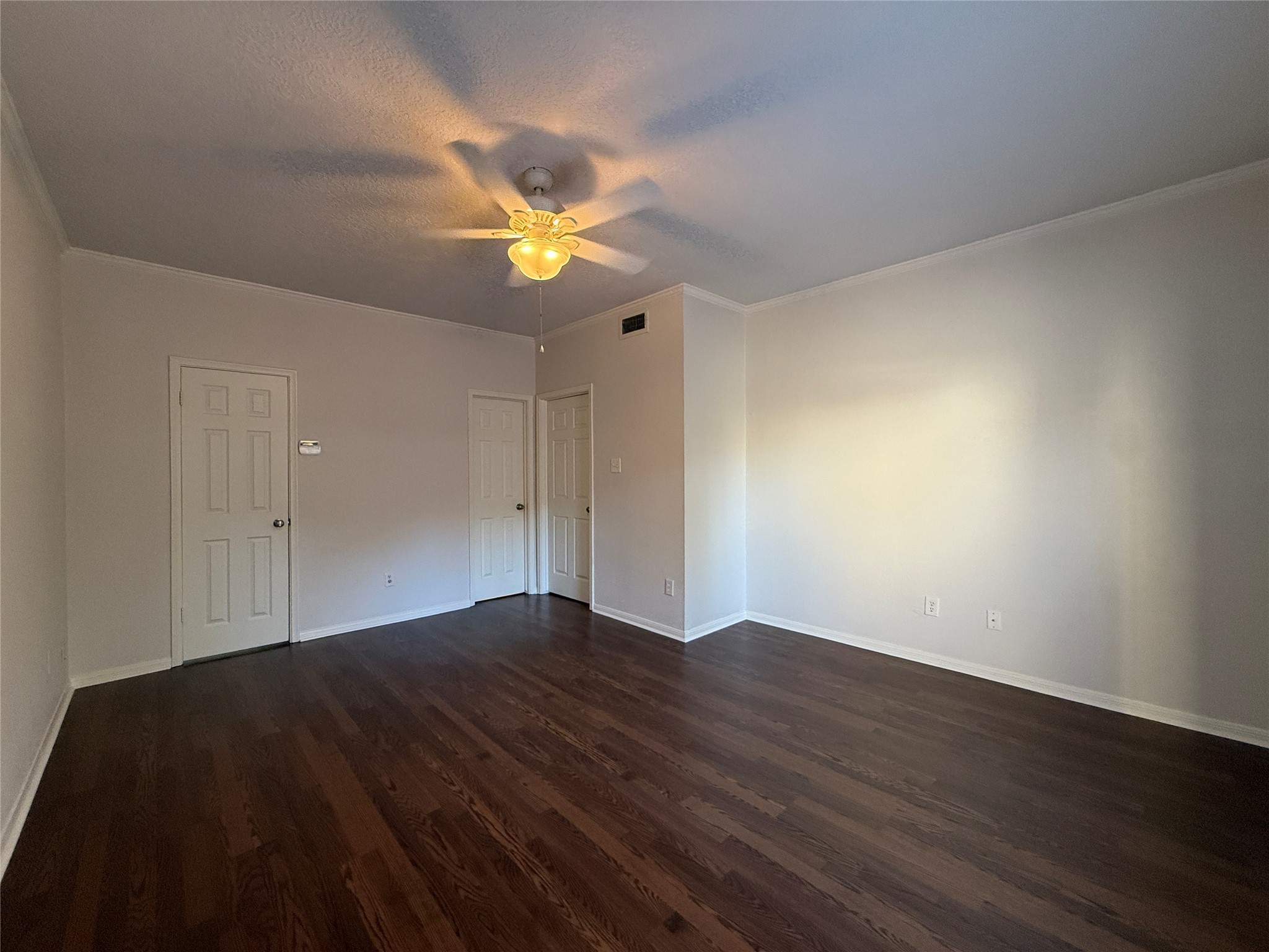 2125 Augusta Drive, Unit 83 Houston, TX 77057 - Photo 17 of 34 a view of empty room with wooden floor and fan