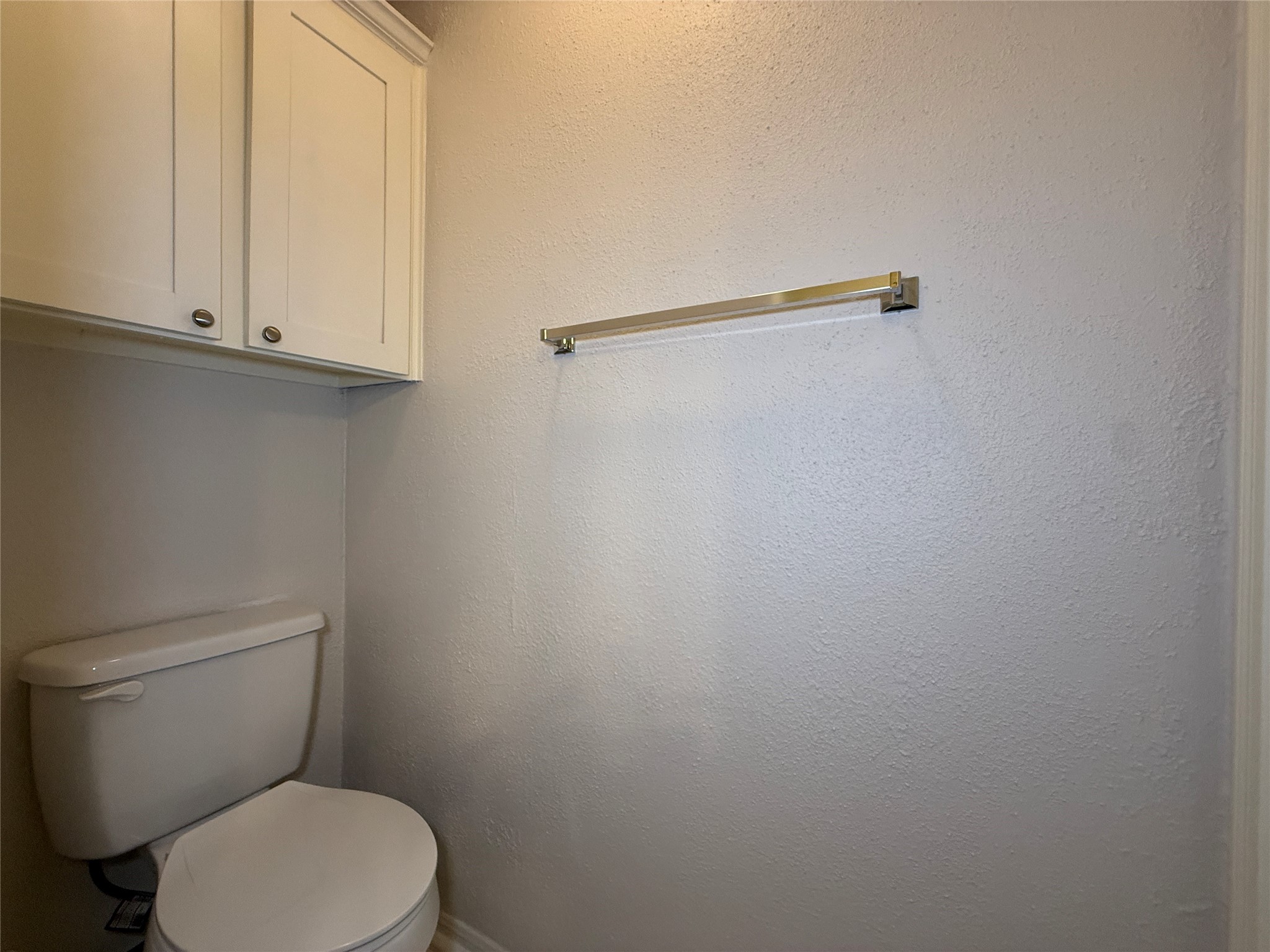2125 Augusta Drive, Unit 83 Houston, TX 77057 - Photo 22 of 34 a white toilet sitting next to a shower