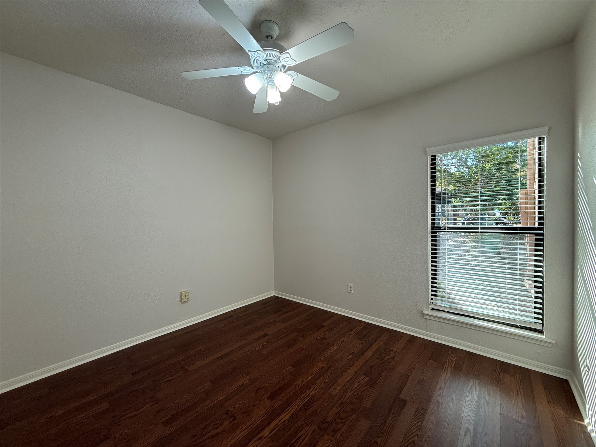 2125 Augusta Drive, Unit 83 Houston, TX 77057 - Photo 25 of 34 an empty room with wooden floor and windows