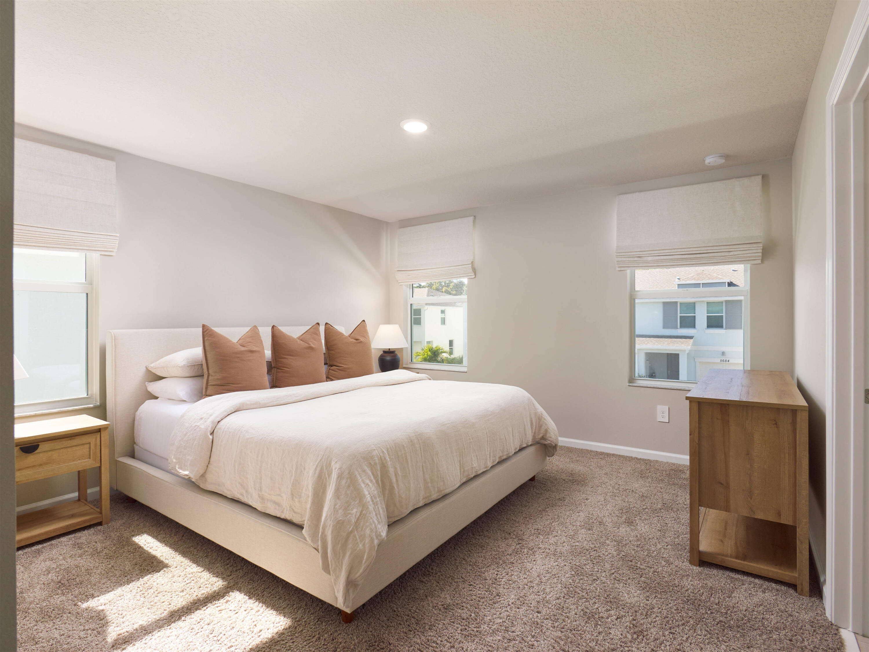 5735 Southeast Edgewater Circle Stuart, FL 34997 - Photo 17 of 39 a bedroom with bed and window