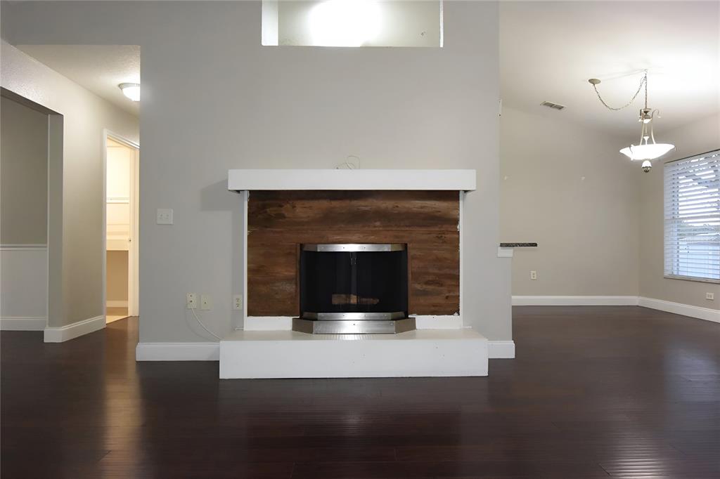 12042 Linden Drive Spring Hill, FL 34608 - Photo 12 of 41 a living room with wooden floor and fireplace