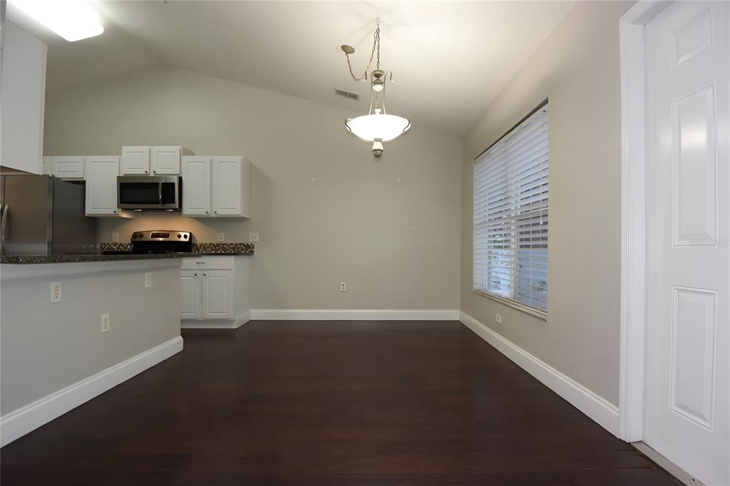 12042 Linden Drive Spring Hill, FL 34608 - Photo 13 of 41 a kitchen with a sink stainless steel appliances and a window