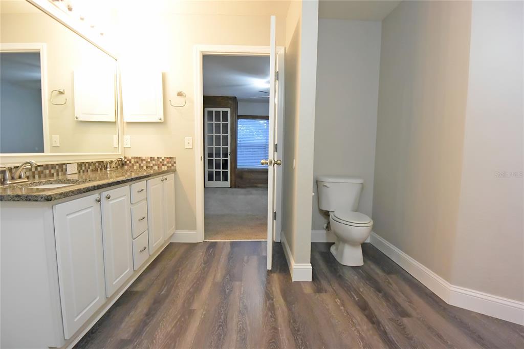 12042 Linden Drive Spring Hill, FL 34608 - Photo 26 of 41 a bathroom with a sink toilet and shower