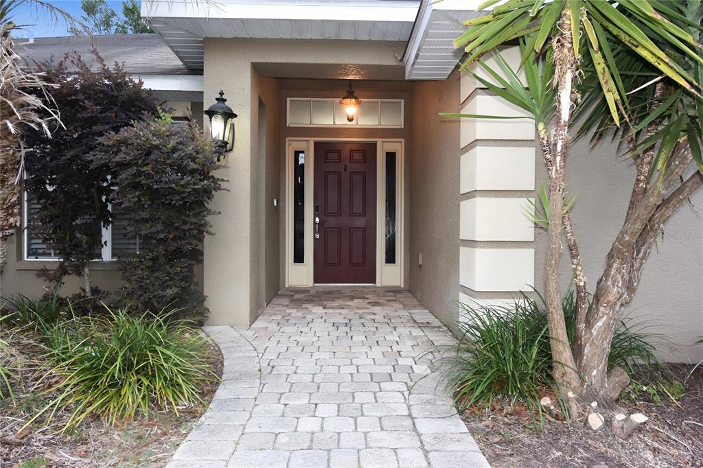 12042 Linden Drive Spring Hill, FL 34608 - Photo 3 of 41 a front view of a house with a yard
