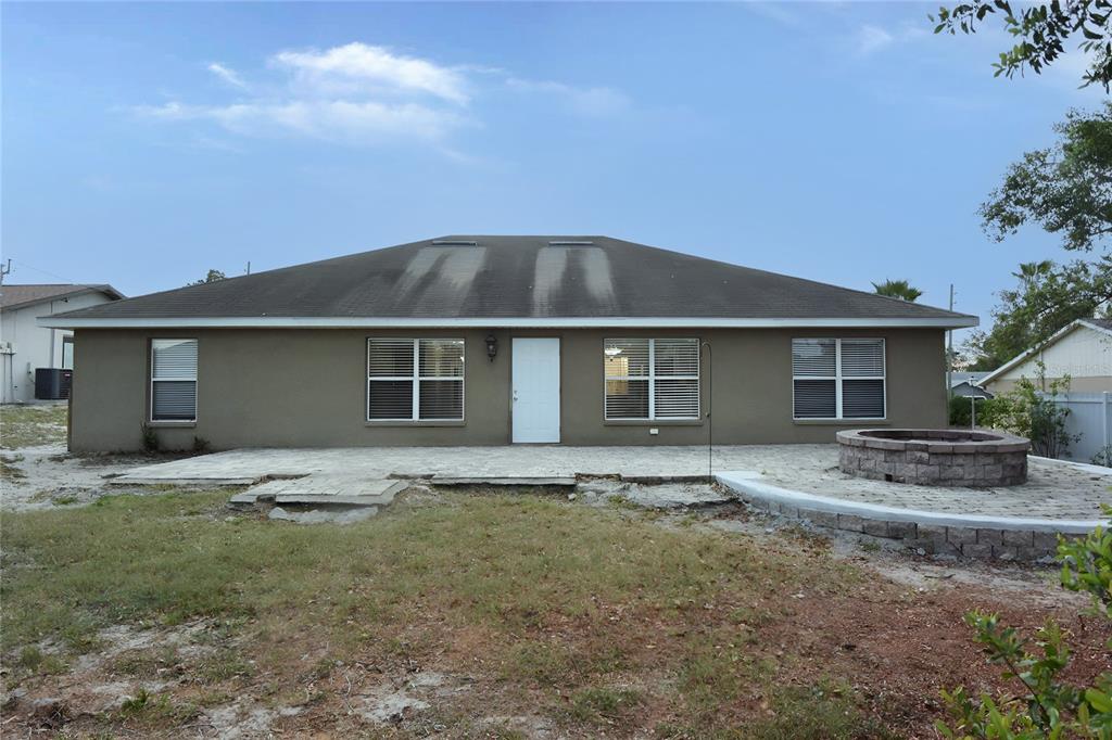 12042 Linden Drive Spring Hill, FL 34608 - Photo 31 of 41 a house with yard in front of it