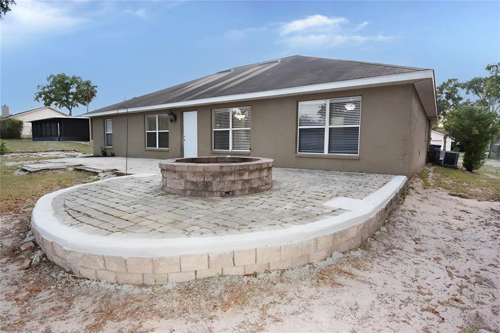 12042 Linden Drive Spring Hill, FL 34608 - Photo 34 of 41 a view of a house with backyard and sitting area