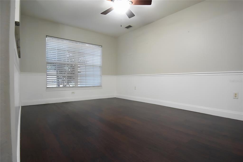 12042 Linden Drive Spring Hill, FL 34608 - Photo 7 of 41 an empty room with a empty space and windows