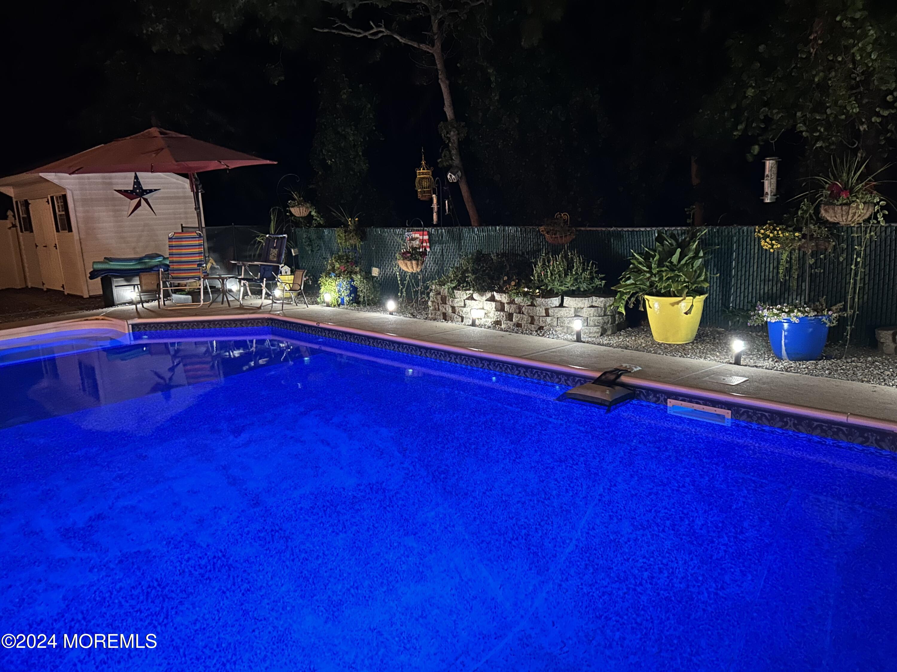136 Smith Circle Point Pleasant, NJ 08742 - Photo 20 of 35 a kitchen with stainless steel appliances a sink dishwasher with granite countertops and chairs