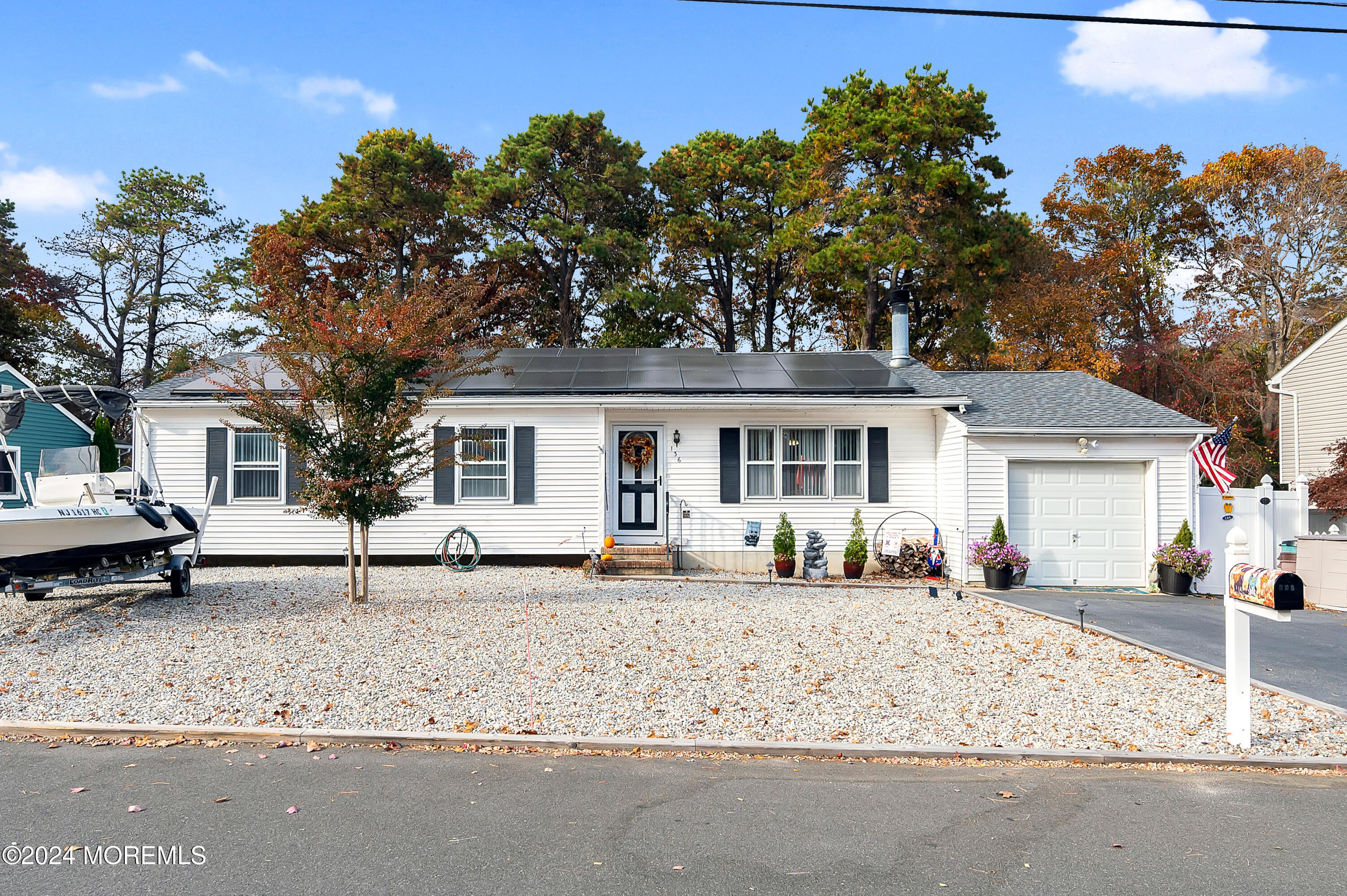 136 Smith Circle Point Pleasant, NJ 08742 - Photo 2 of 35 a front view of a house with a sitting area