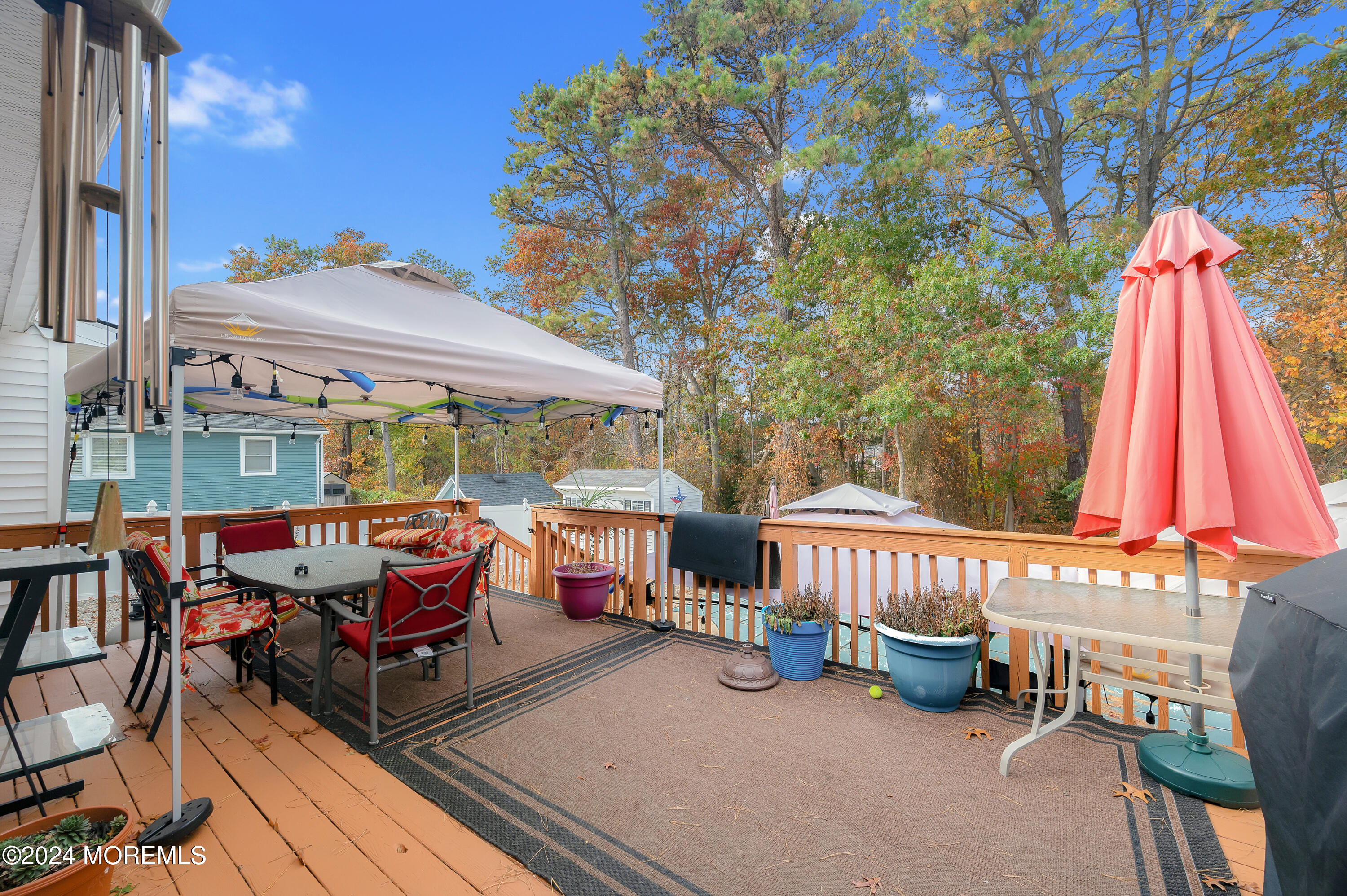 136 Smith Circle Point Pleasant, NJ 08742 - Photo 25 of 35 a view of a patio with a table and chairs under an umbrella