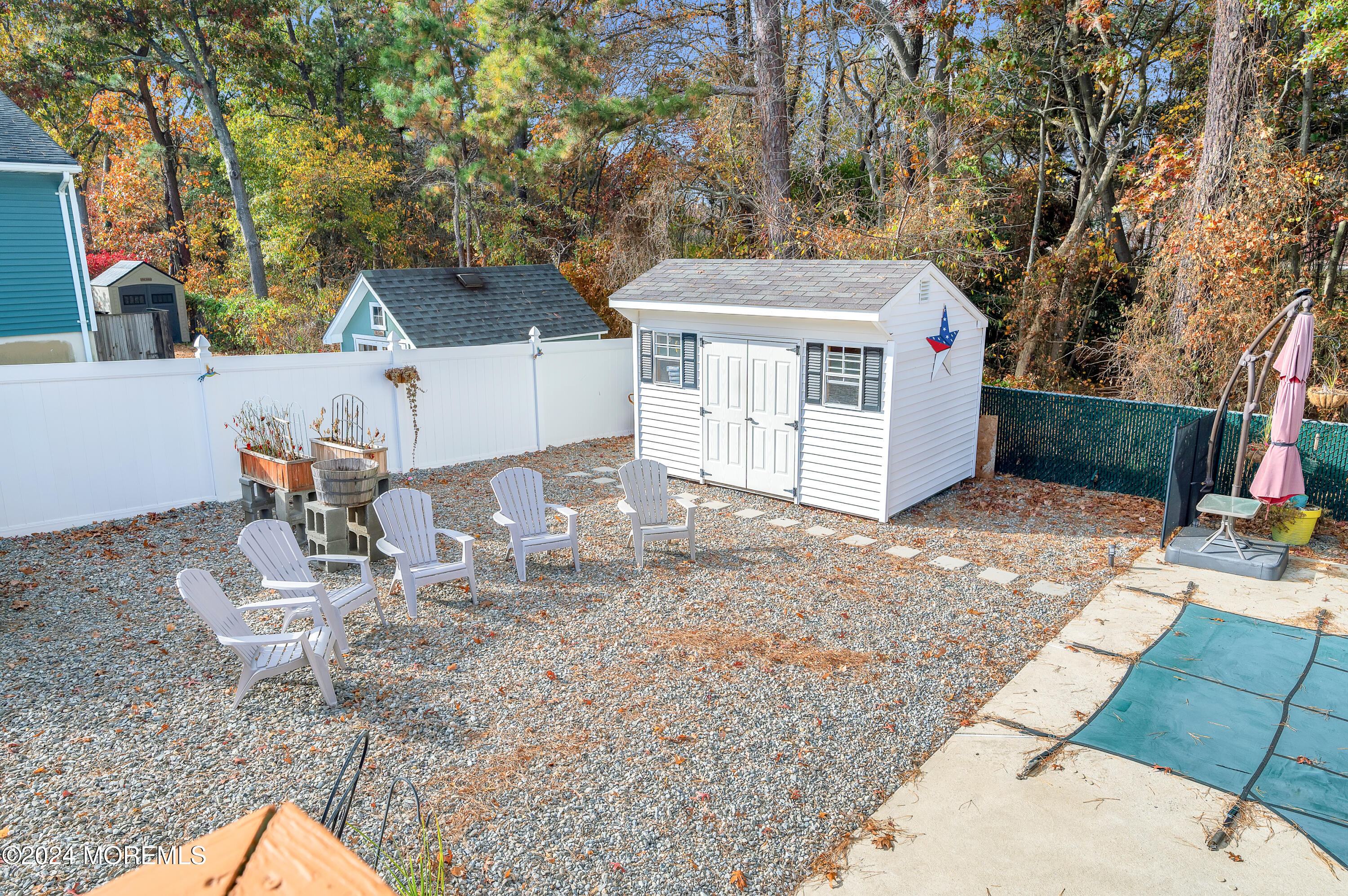 136 Smith Circle Point Pleasant, NJ 08742 - Photo 26 of 35 a view of a chairs and table in backyard