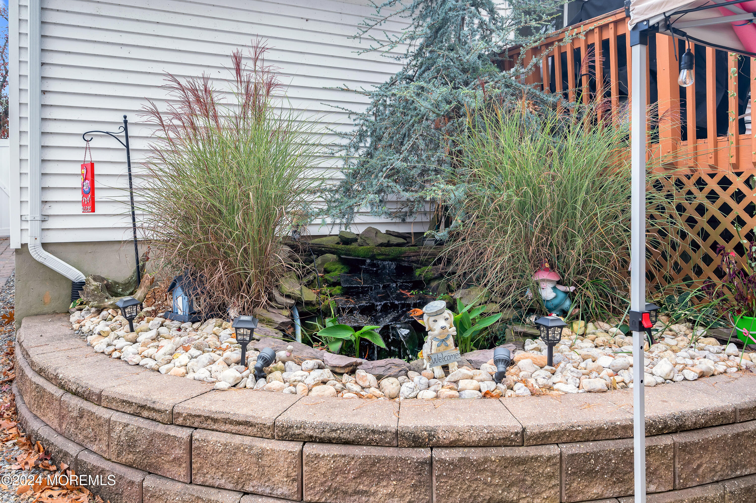 136 Smith Circle Point Pleasant, NJ 08742 - Photo 27 of 35 a view of a house with a yard and sitting area