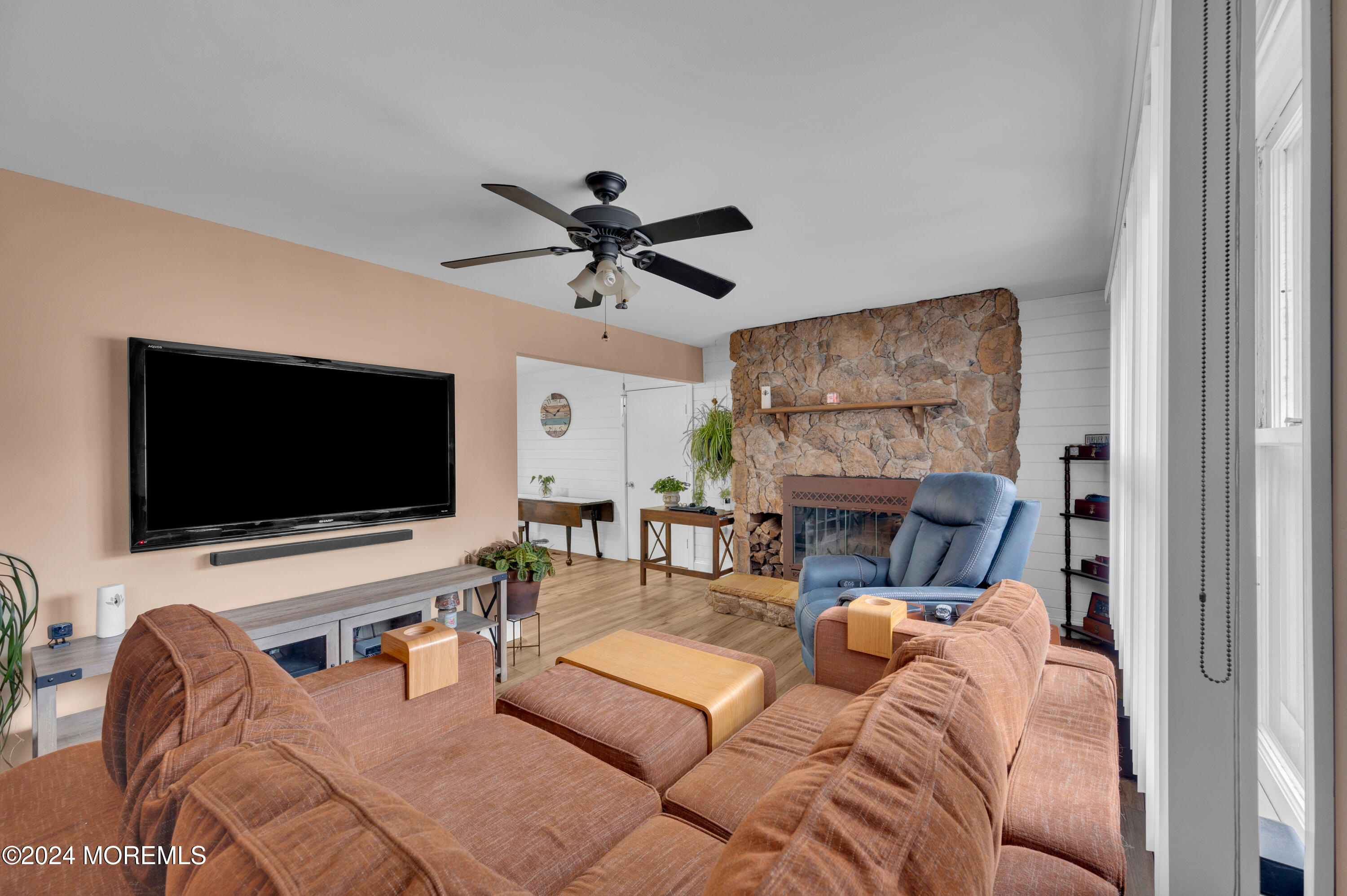 136 Smith Circle Point Pleasant, NJ 08742 - Photo 3 of 35 a living room with furniture and a flat screen tv