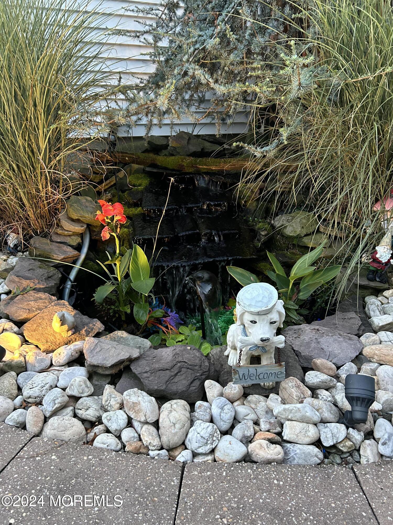 136 Smith Circle Point Pleasant, NJ 08742 - Photo 30 of 35 a view of an chairs and table in a backyard