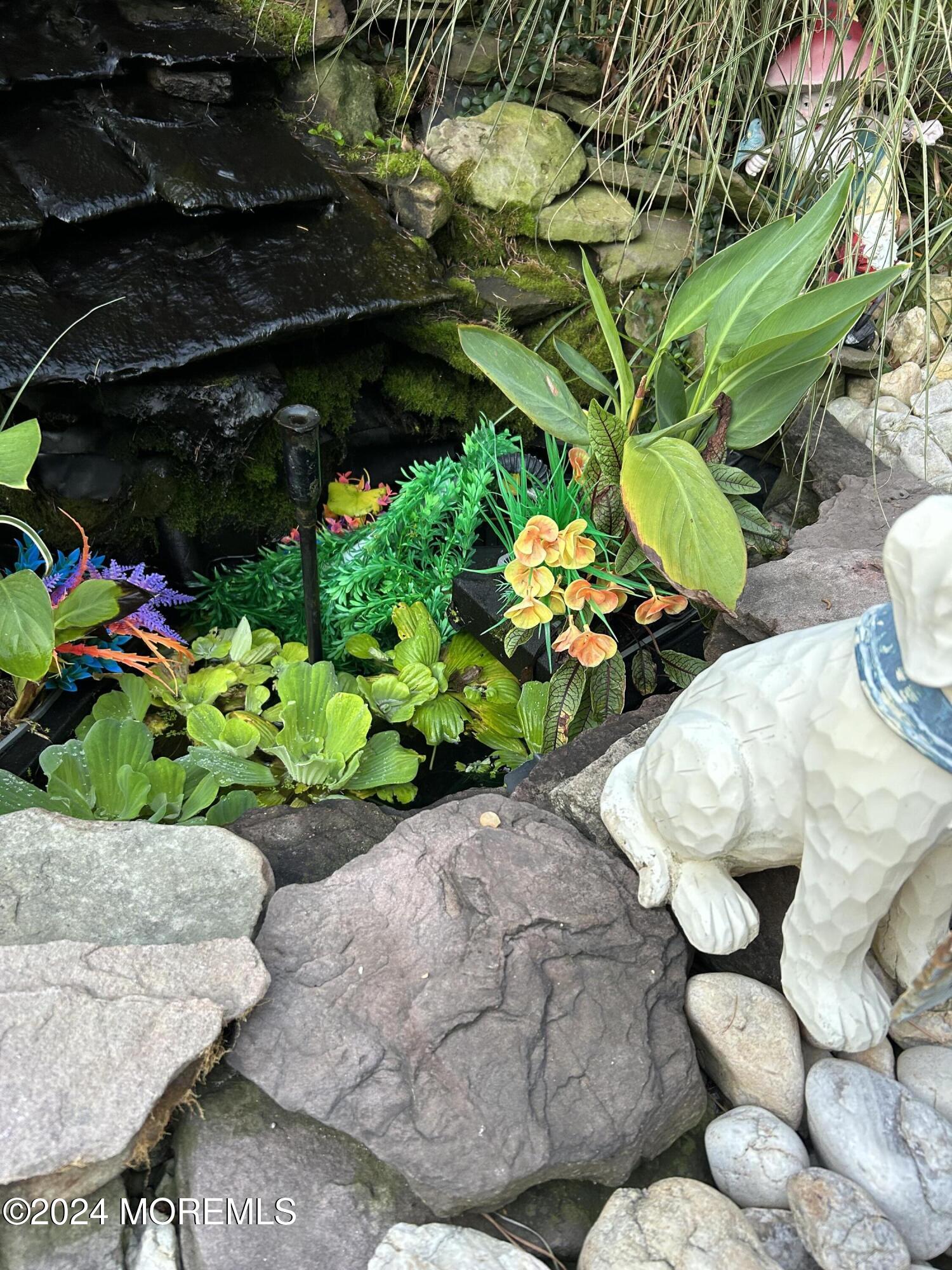 136 Smith Circle Point Pleasant, NJ 08742 - Photo 34 of 35 a bunch of flowers sitting in a garden