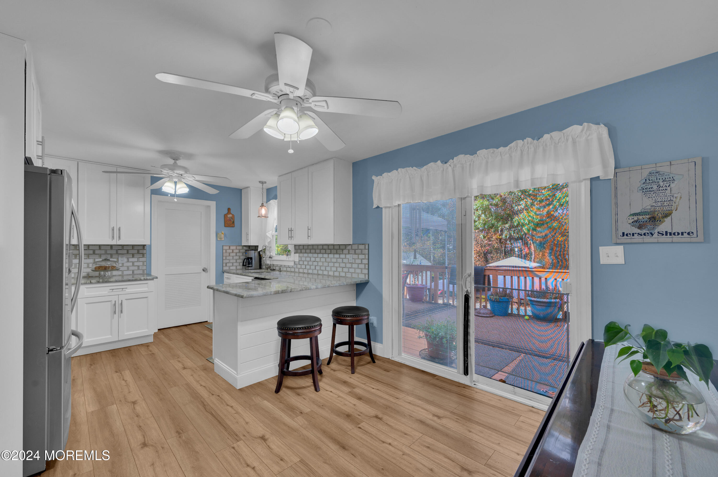 136 Smith Circle Point Pleasant, NJ 08742 - Photo 6 of 35 a kitchen with kitchen island a counter top space a sink appliances and cabinets