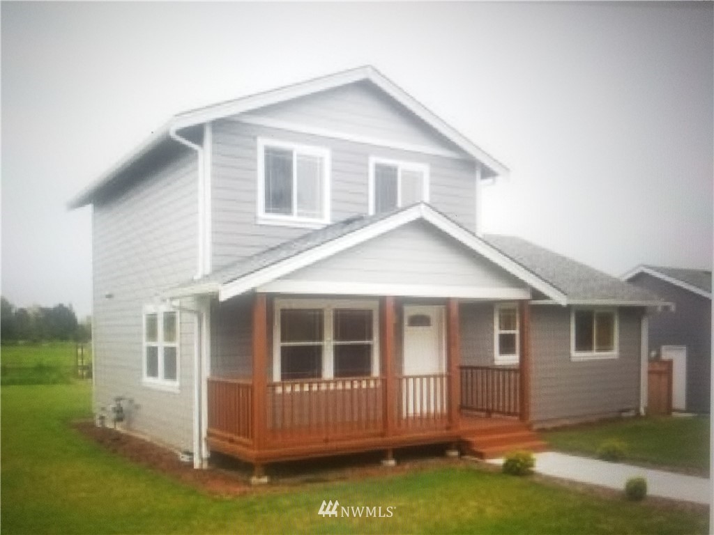5560 South Church Road Ferndale, WA 98248 - Photo 1 of 1 a front view of a house with a garden