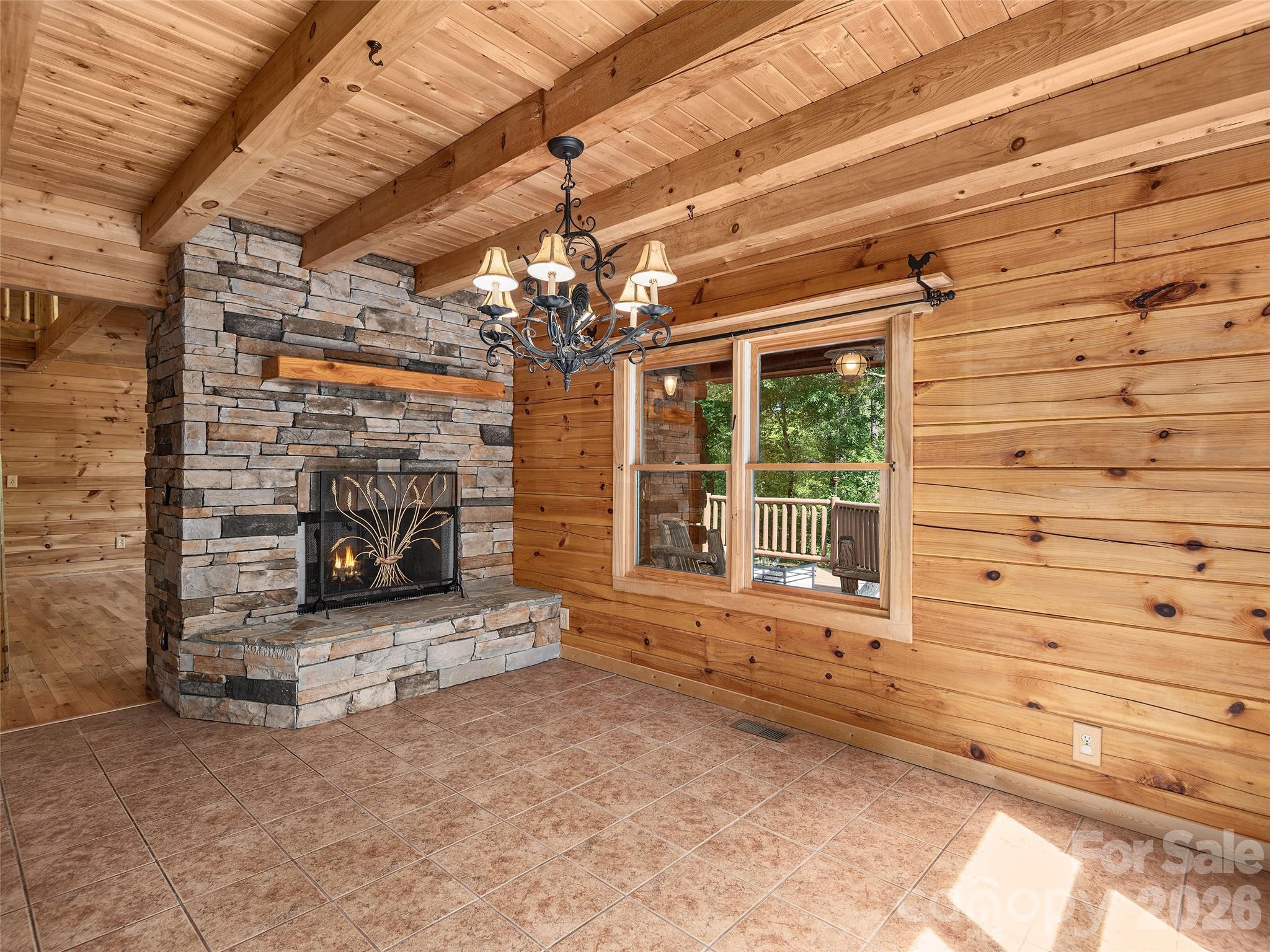 413 Green Hills Road Mill Spring, NC 28756 - Photo 10 of 48 a view of a livingroom with a fireplace