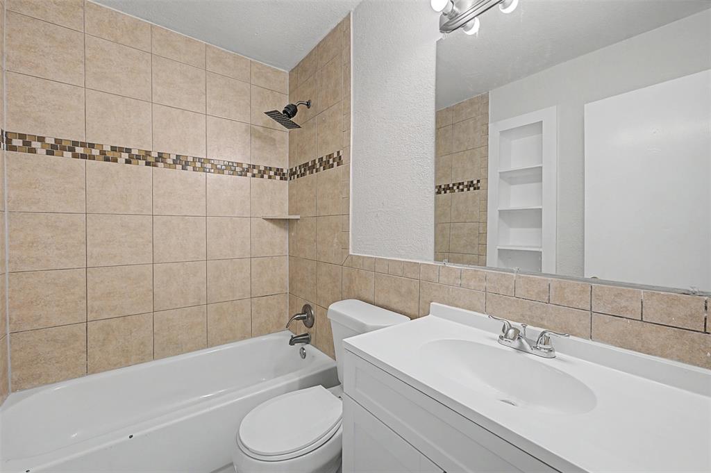 9021 White Settlement Road White Settlement, TX 76108 - Photo 13 of 33 a bathroom with a sink toilet and shower