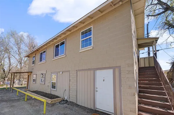 a view of a house with a yard and garage