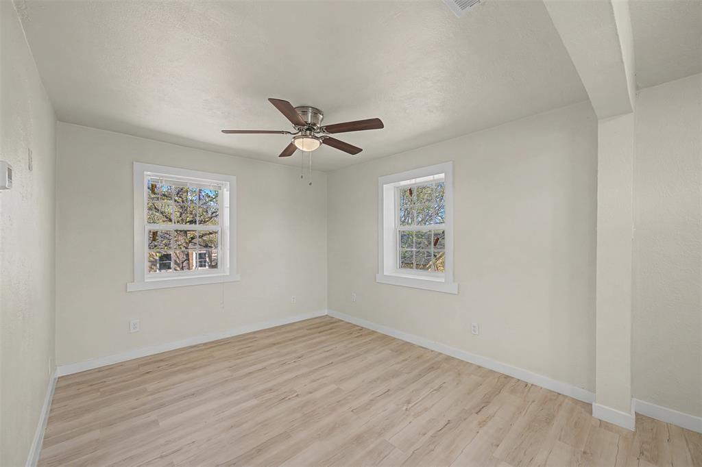 9021 White Settlement Road White Settlement, TX 76108 - Photo 19 of 33 a view of a big room with wooden floor and windows