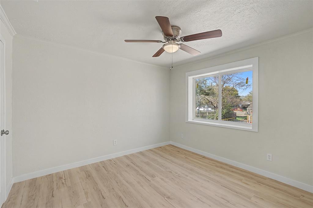 9021 White Settlement Road White Settlement, TX 76108 - Photo 20 of 33 a view of a big room with wooden floor closet and fan