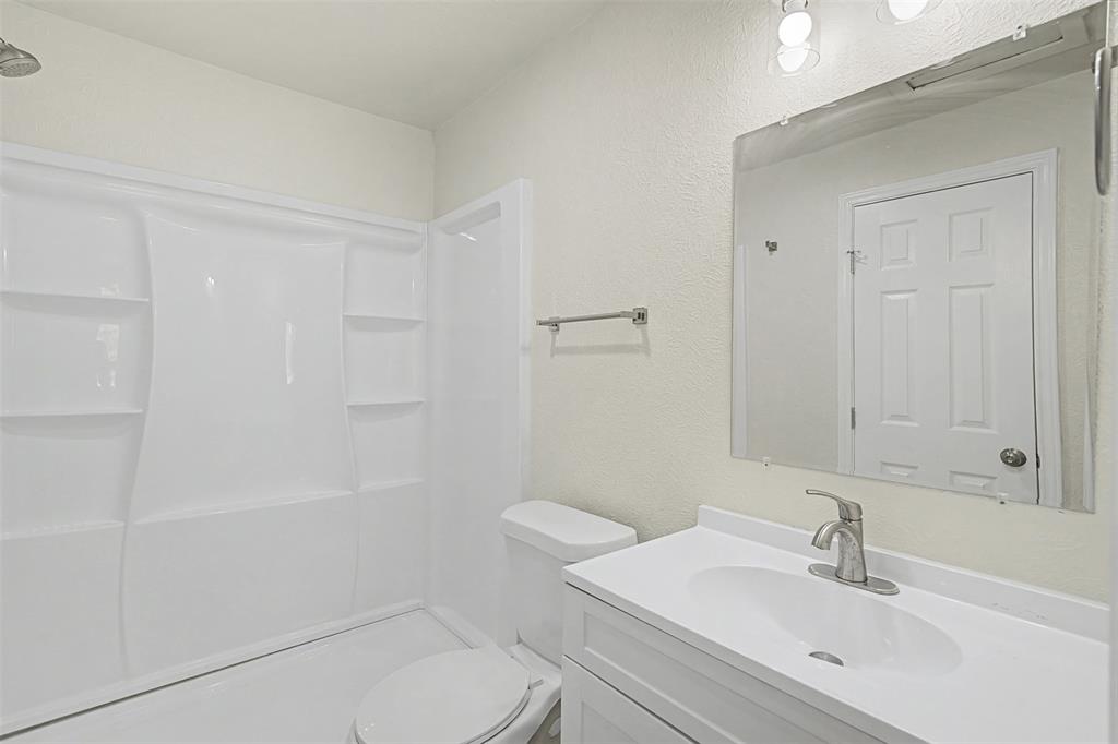 9021 White Settlement Road White Settlement, TX 76108 - Photo 21 of 33 a bathroom with a sink a toilet and shower
