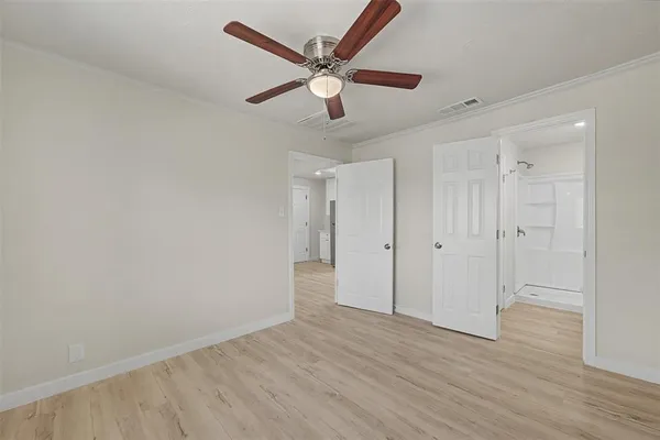 a kitchen with stainless steel appliances a refrigerator and a stove top oven