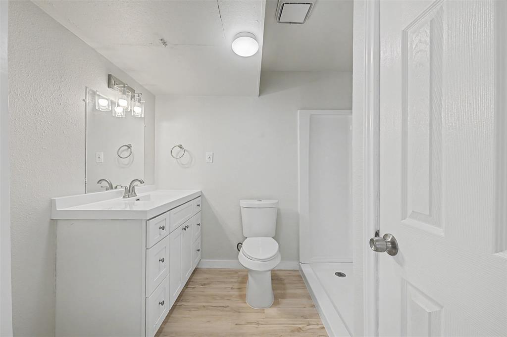 9021 White Settlement Road White Settlement, TX 76108 - Photo 27 of 33 a spacious bathroom with a toilet sink and mirror