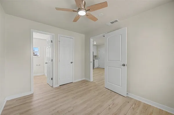 a bathroom with a sink mirror and toilet