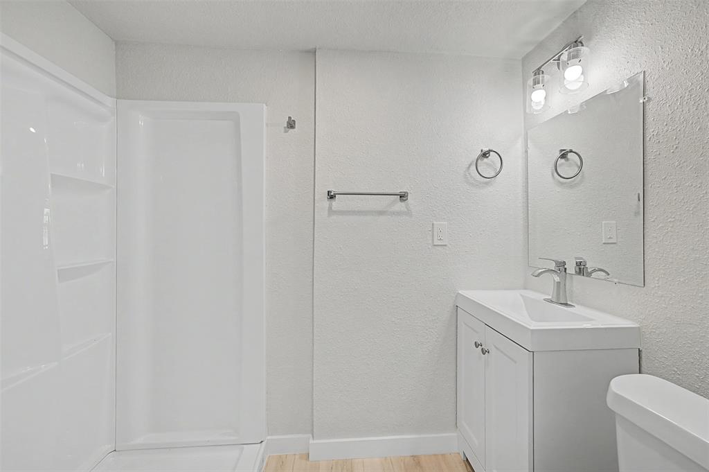 9021 White Settlement Road White Settlement, TX 76108 - Photo 30 of 33 a bathroom with a sink mirror and toilet