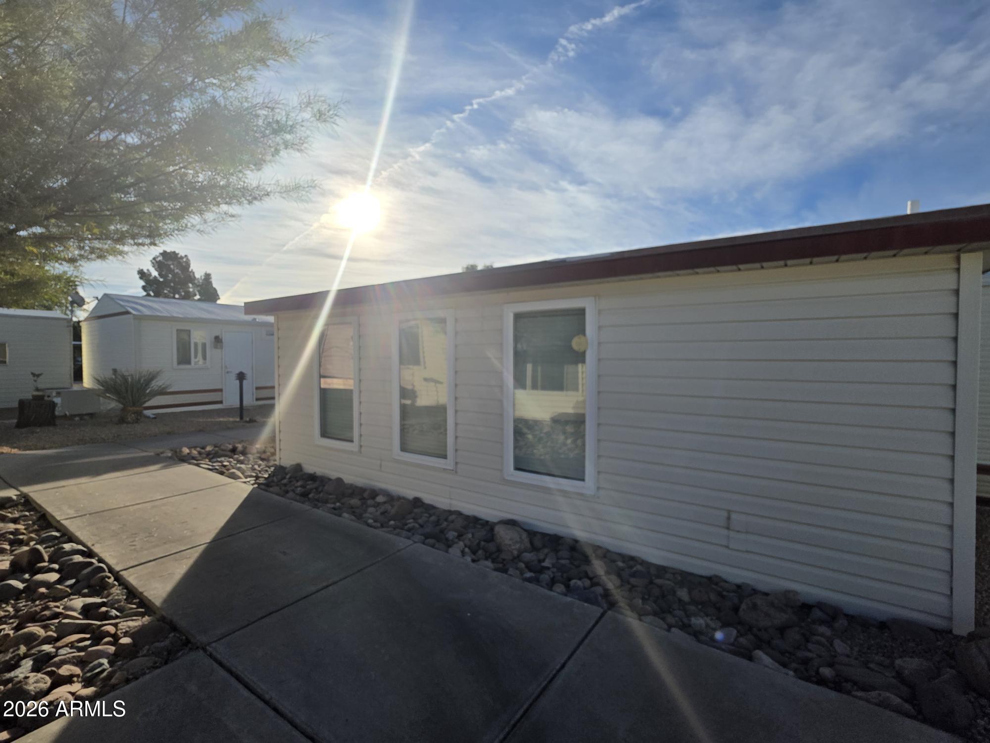 17200 West Bell Road, Unit 2169 Surprise, AZ 85374 - Photo 22 of 25 a house view with a backyard