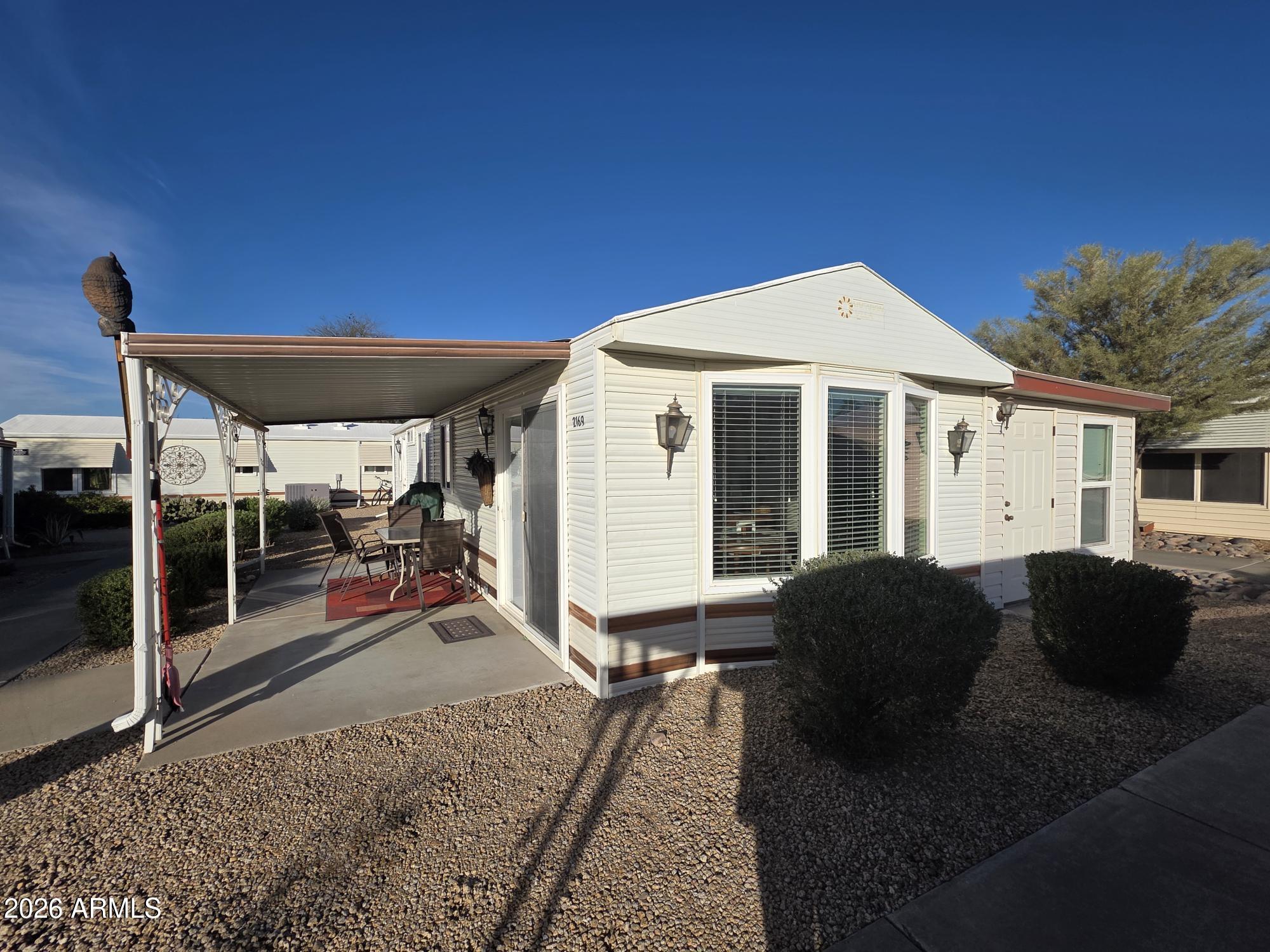17200 West Bell Road, Unit 2169 Surprise, AZ 85374 - Photo 24 of 25 a front view of a house with a porch