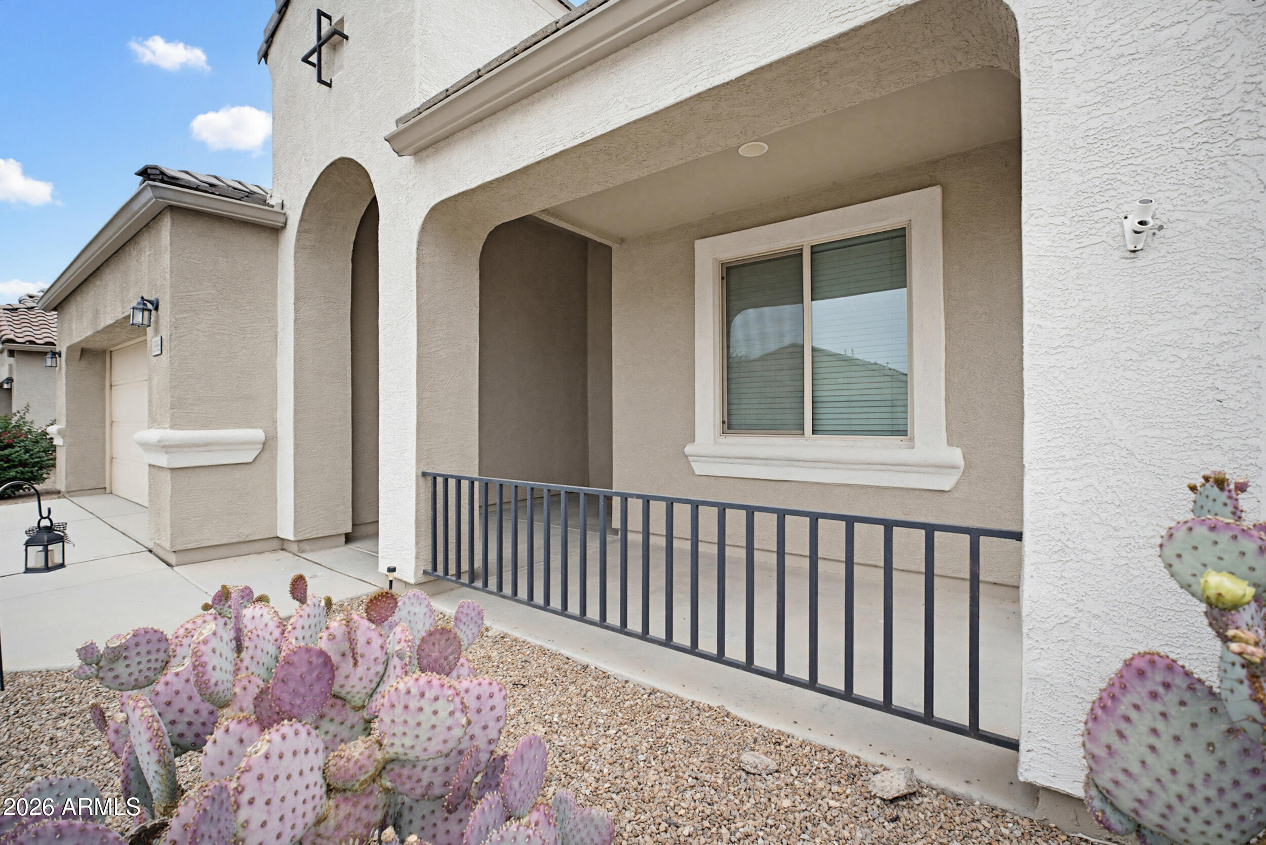 19995 North Ben Court Maricopa, AZ 85138 - Photo 8 of 51 a front view of a house with wooden fence