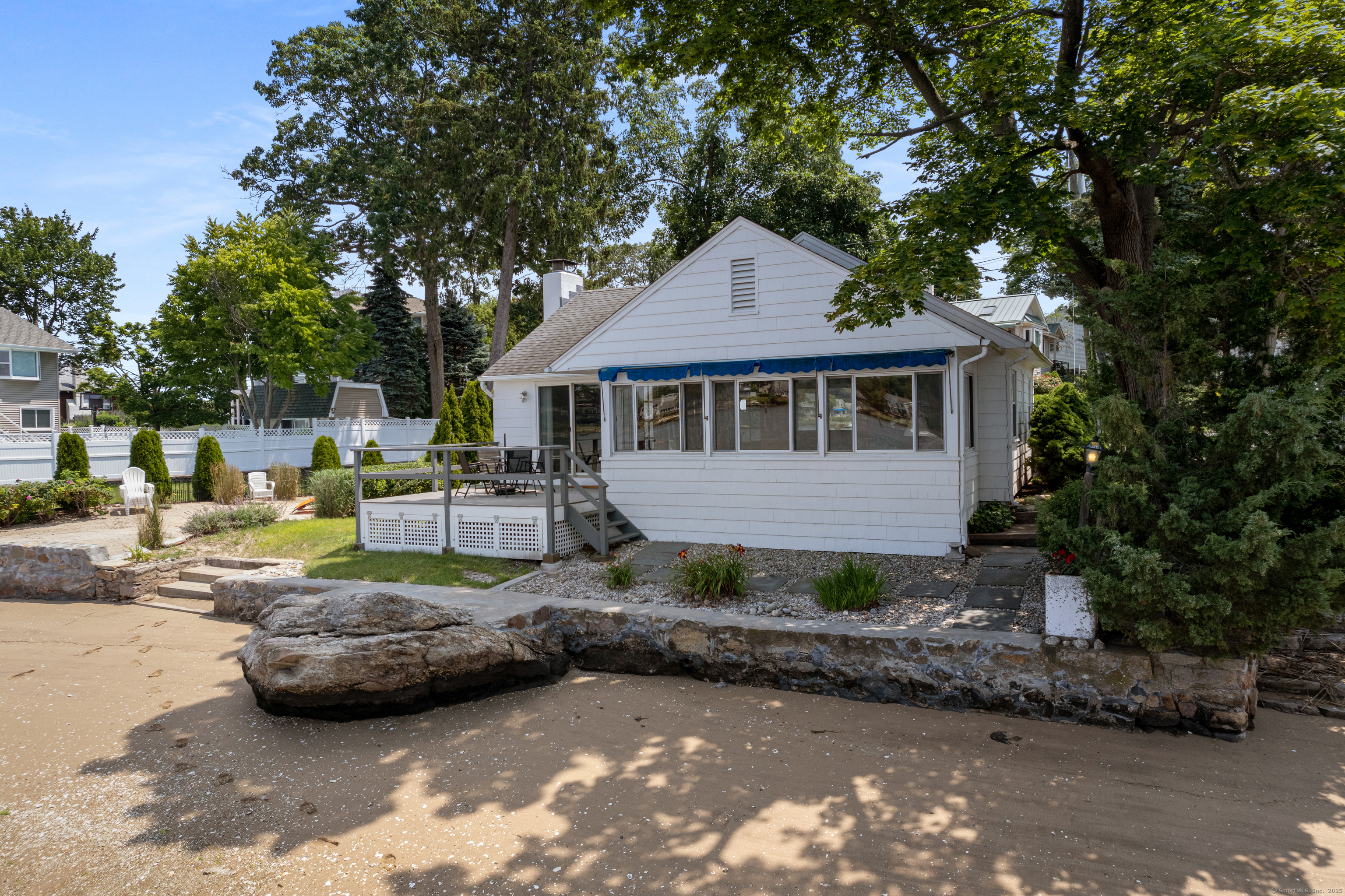 15 River Road Branford, CT 06405 - Photo 12 of 32 a view of a house with backyard sitting area and swimming pool