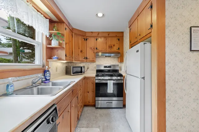 a kitchen that has a sink and a window