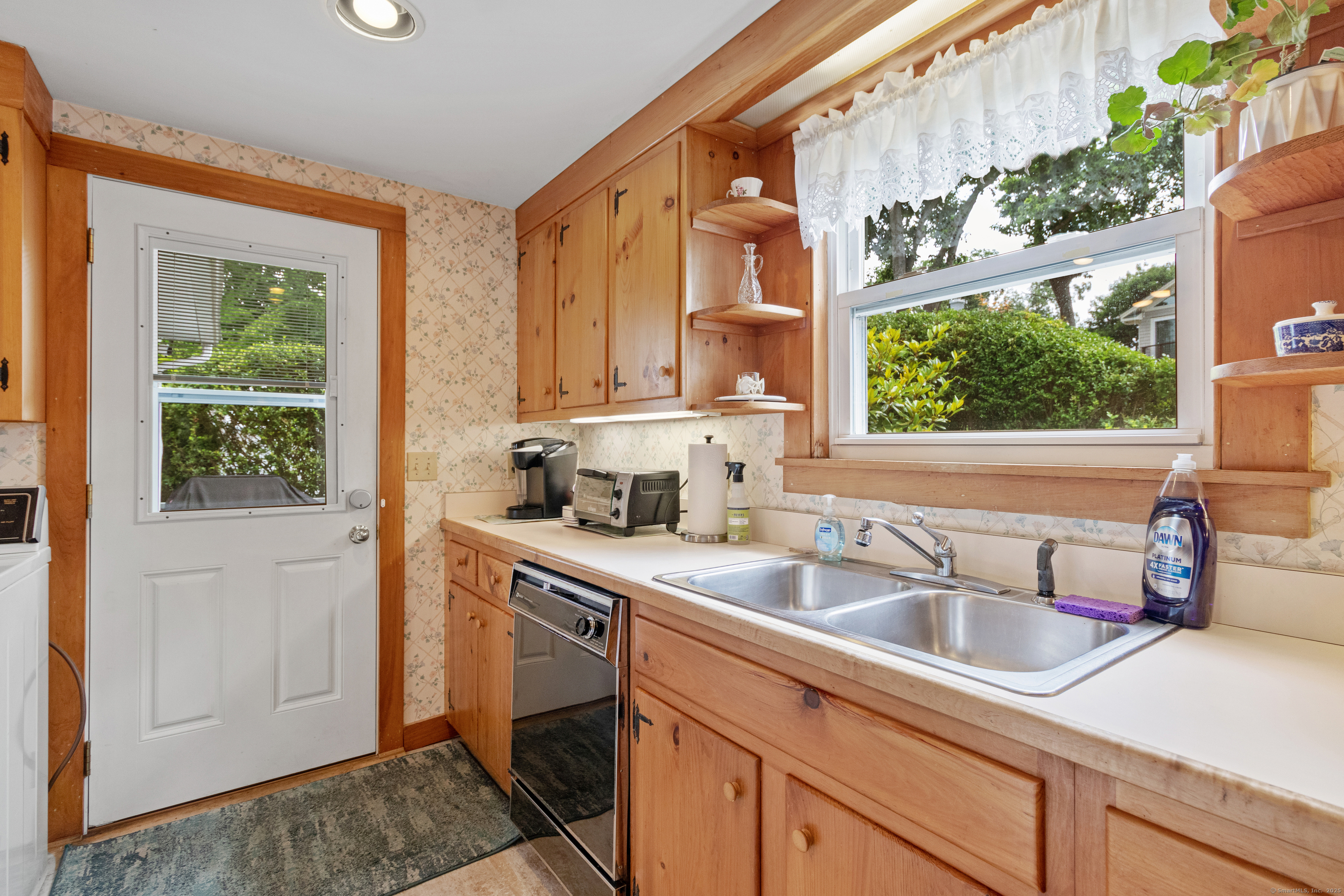 15 River Road Branford, CT 06405 - Photo 14 of 32 a kitchen that has a sink and a window