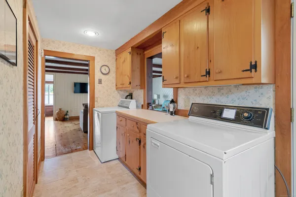 a kitchen with lot of counter top space and cabinets