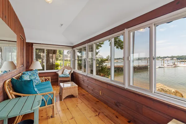 a living room with furniture and windows