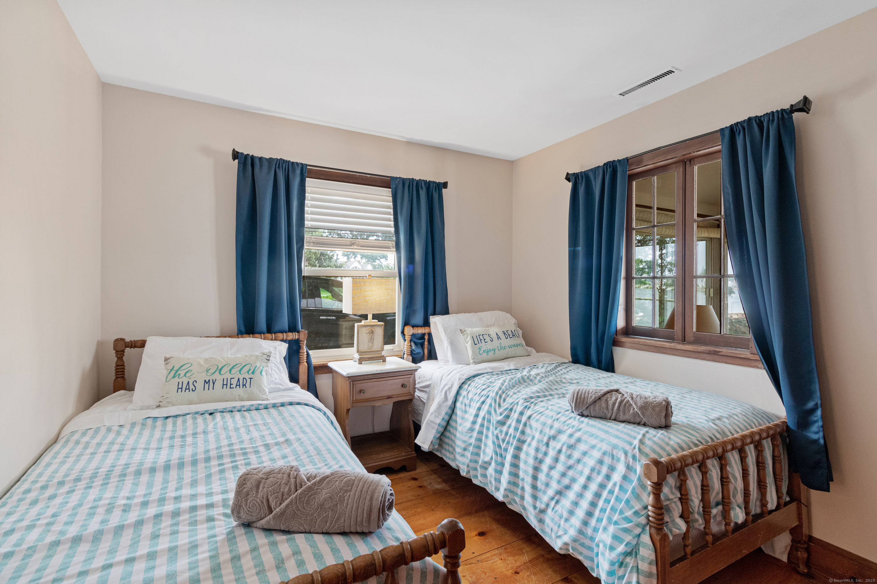 15 River Road Branford, CT 06405 - Photo 23 of 32 a bedroom with two beds and a large window