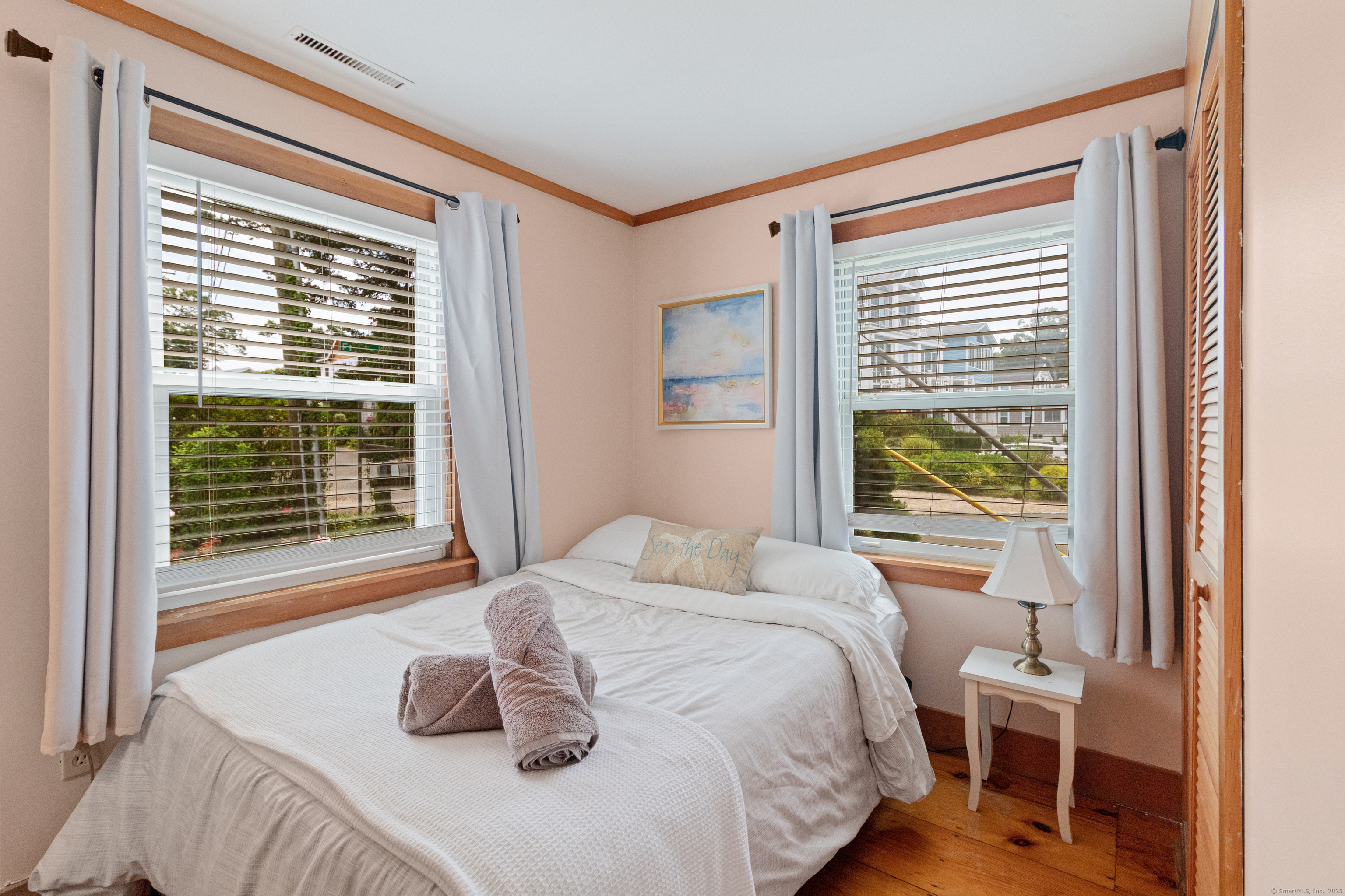 15 River Road Branford, CT 06405 - Photo 25 of 32 a bedroom with a bed and a window