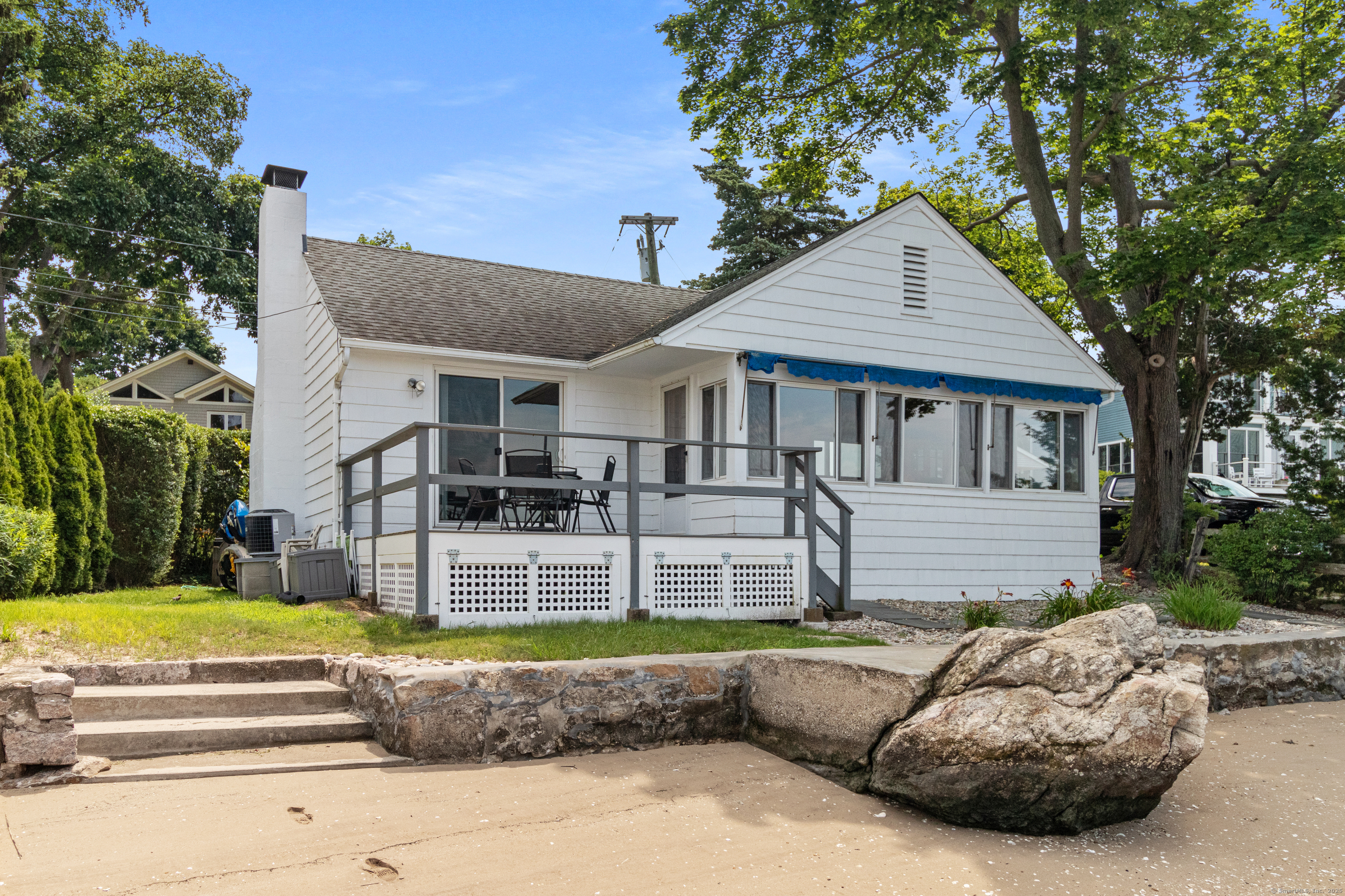 15 River Road Branford, CT 06405 - Photo 27 of 32 a view of a house with a large pool and a yard
