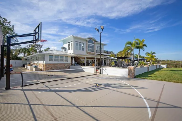 a kitchen with kitchen island granite countertop a sink counter top space and cabinets