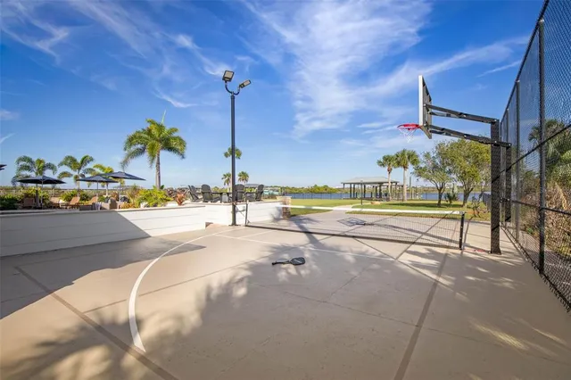 a view of a house with swimming pool and sitting area