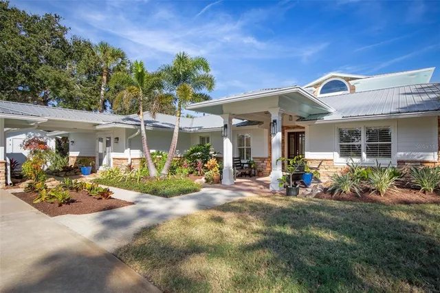 a view of a livingroom with workspace and a window